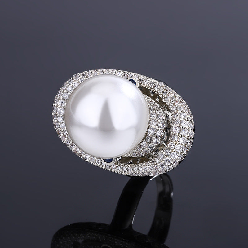 Celestial Saturn-Inspired Pearl and Crystal Halo Statement Ring