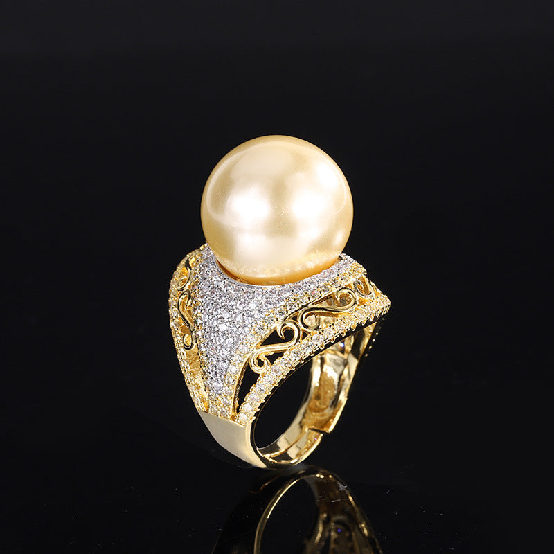 Luxurious Golden Pearl Ring with Shimmering Crystal Accents