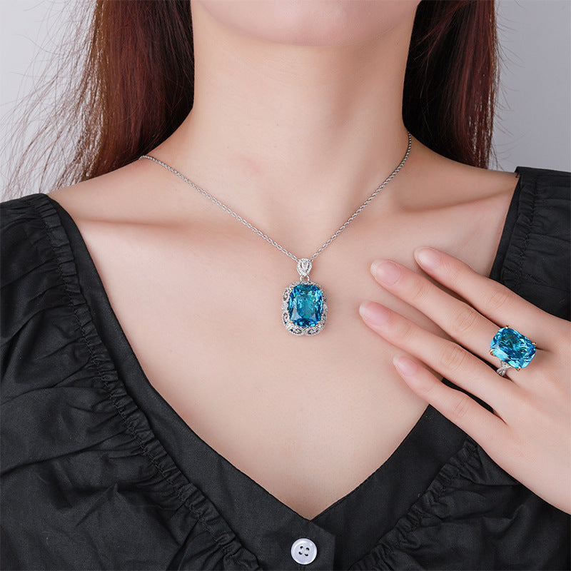 Opulent Cushion-Cut Blue Stone Halo Necklace & Ring Set