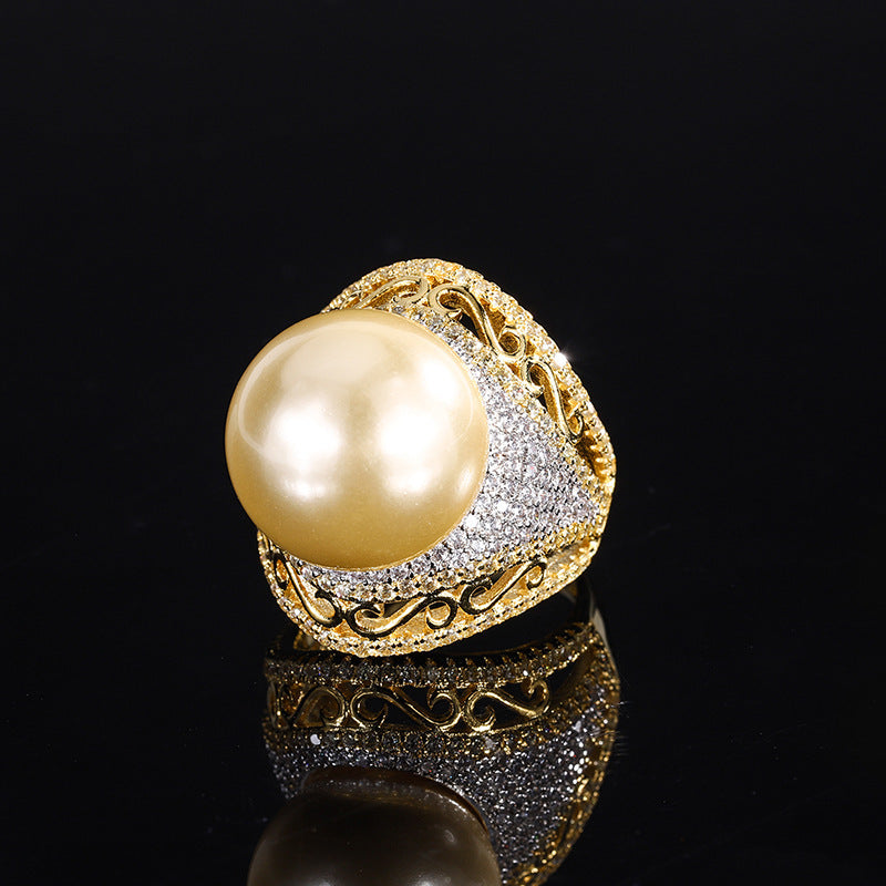 Luxurious Golden Pearl Ring with Shimmering Crystal Accents