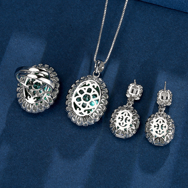 Luxurious Teal Emerald Oval Halo Set