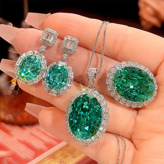 Luxurious Teal Emerald Oval Halo Set