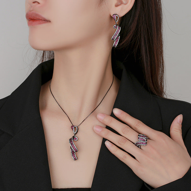 Shimmering Fuchsia Ribbon Swirl Jewelry Set with Black Metal