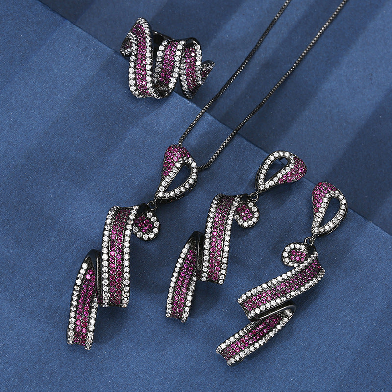 Shimmering Fuchsia Ribbon Swirl Jewelry Set with Black Metal