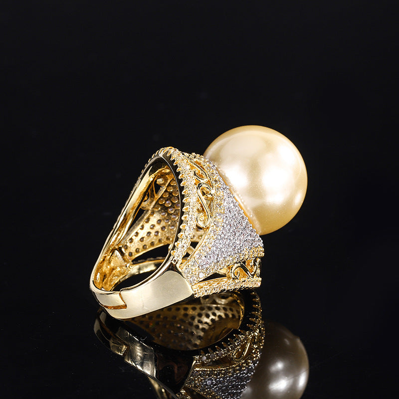 Luxurious Golden Pearl Ring with Shimmering Crystal Accents