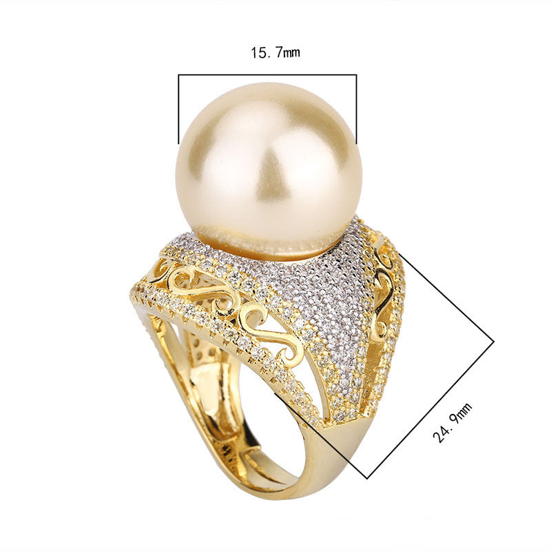 Luxurious Golden Pearl Ring with Shimmering Crystal Accents
